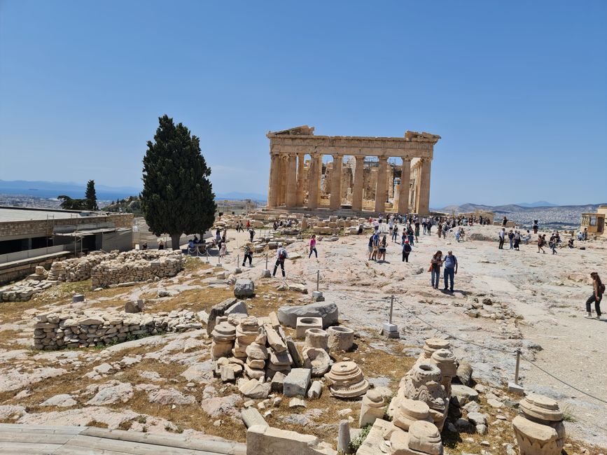 Close-up of sturdy walking shoes on the uneven marble path of the Acropolis in Athens, Greece
