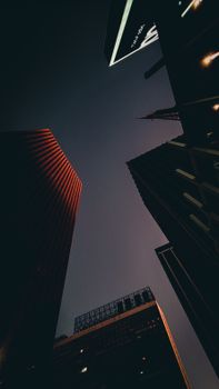 A dramatic upward view of São Paulo's skyscrapers with a night sky backdrop.