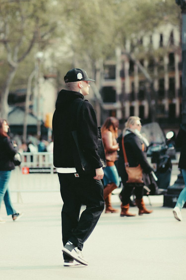 Man In Black Hoodie Jacket And Cap