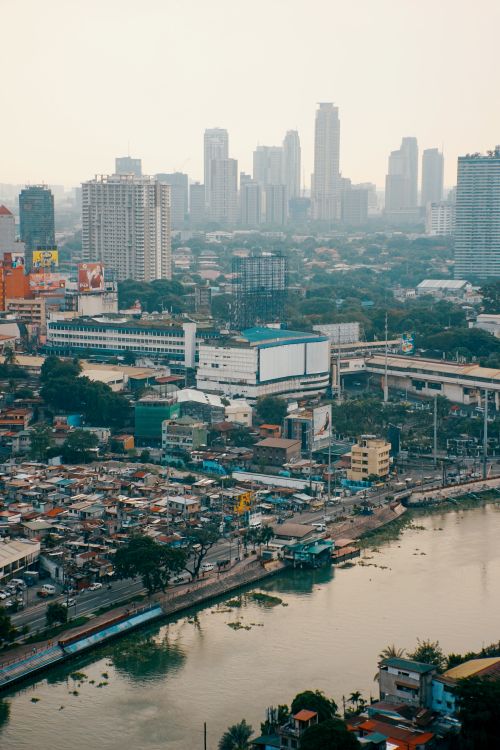 Free A vibrant aerial shot showcasing the urban skyline, river, and skyscrapers. Stock Photo