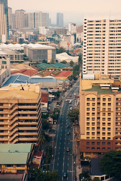 Aerial View of City Buildings Along the Street