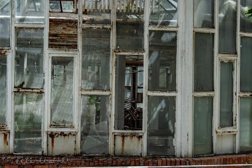 Close-up Photo of a Rusty and Weathered Window