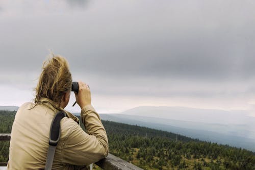 Person Looking at a Scenic View using a Binocular