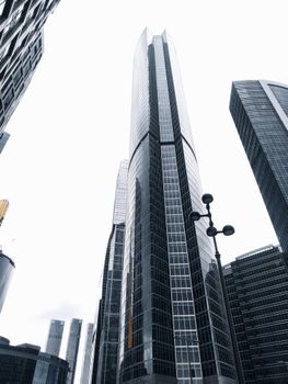 Modern skyscrapers reaching into the bright sky in Moscow's urban landscape.