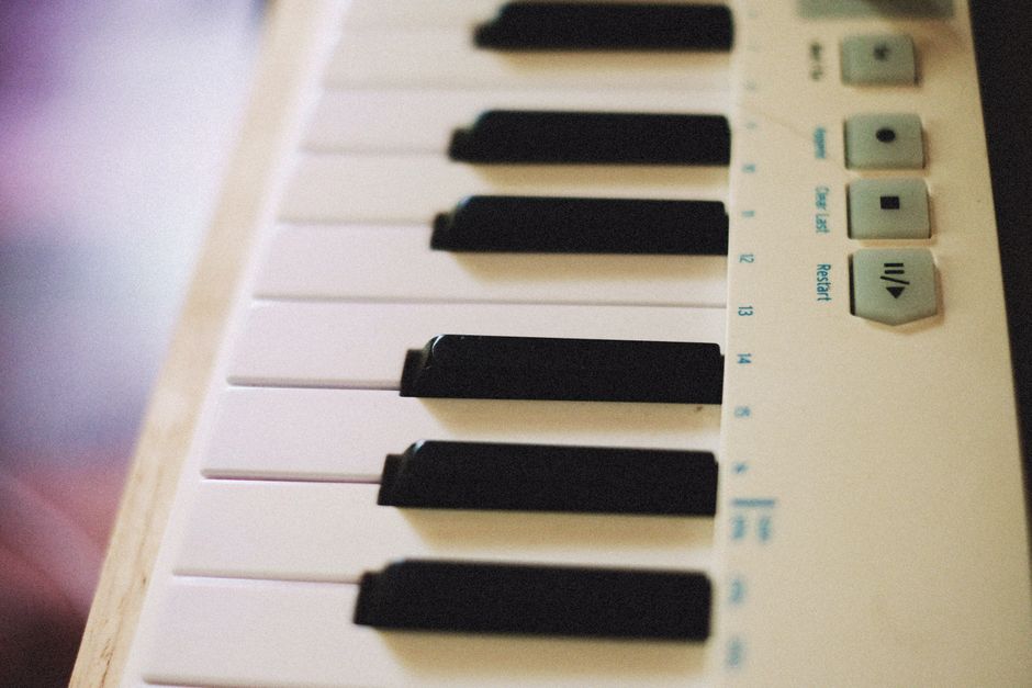 How White Noise Machines Like LectroFan Compare to Hatch Restore for Sleep Detailed view of electronic synthesizer keyboard keys and control panel.