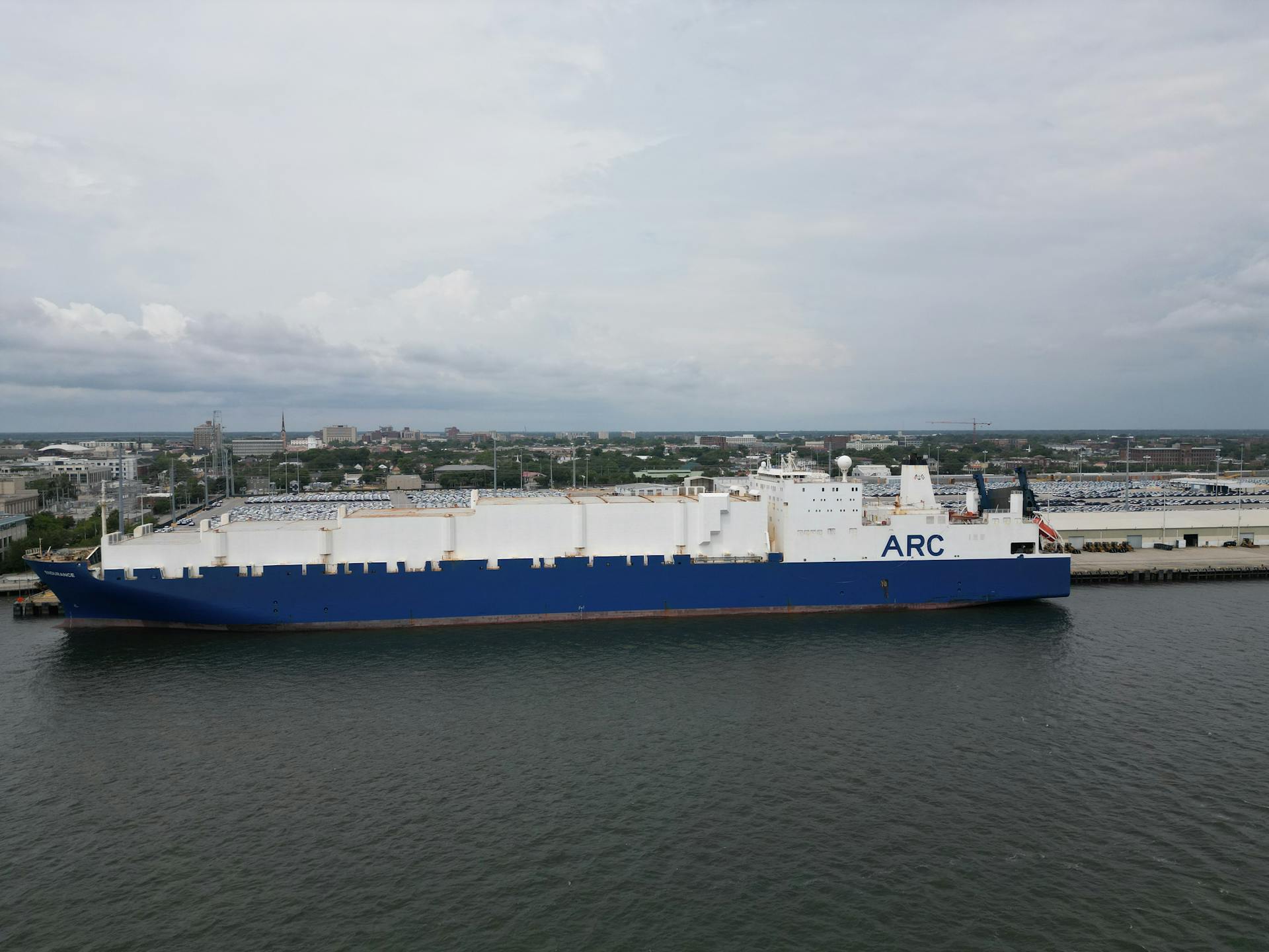 Aerial shot of a large cargo ship docked at Charleston harbor, South Carolina.