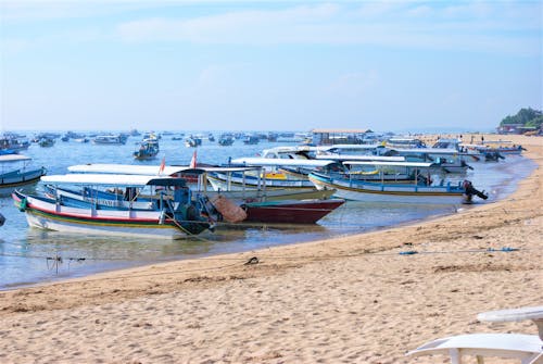 Fishing Boats Docked on Beach Shore