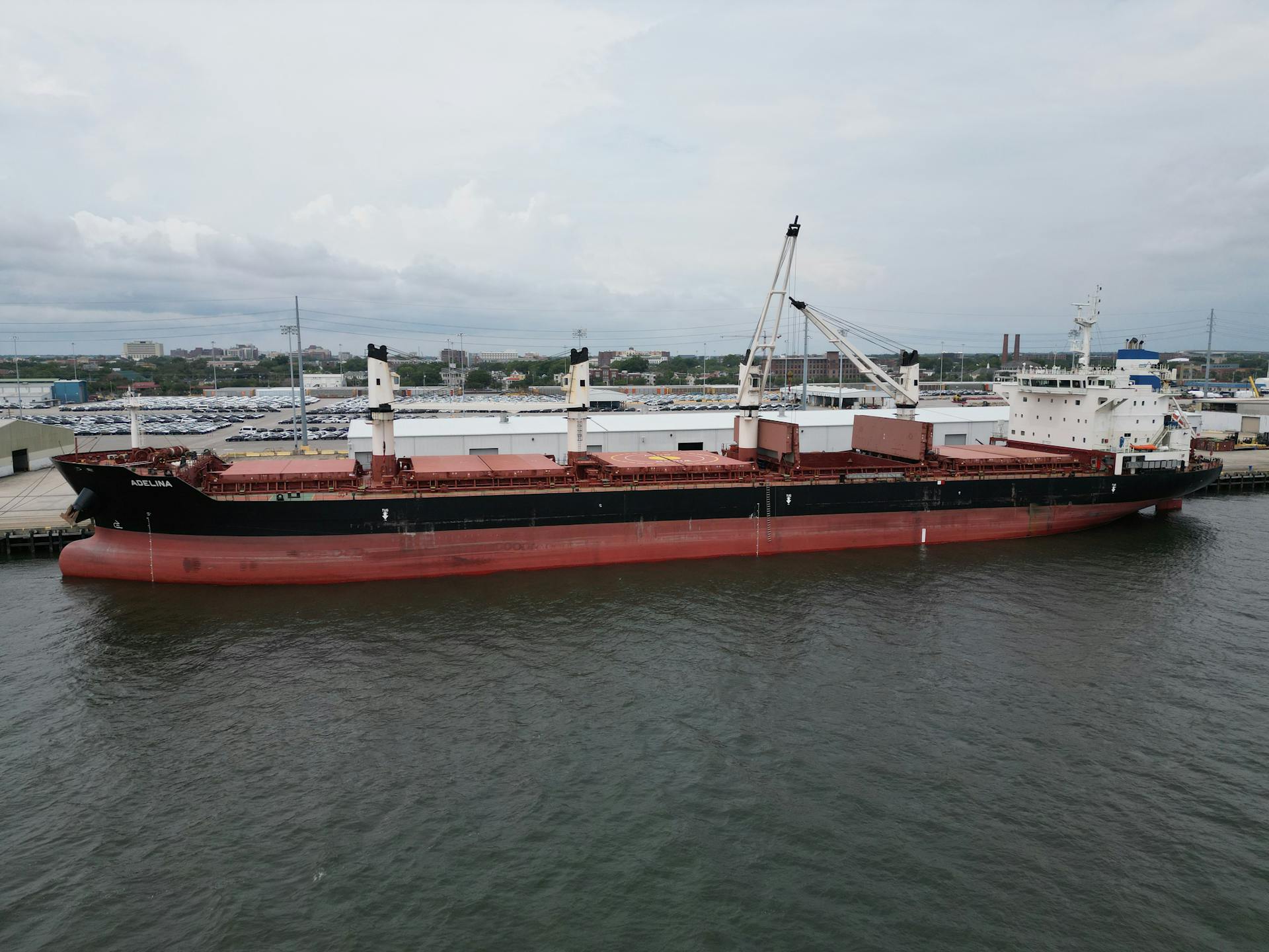 An aerial shot of a cargo ship docked at the Charleston Harbor, South Carolina.