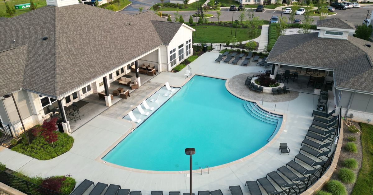 Aerial shot of a stylish apartment complex with a pool in Knoxville, TN.