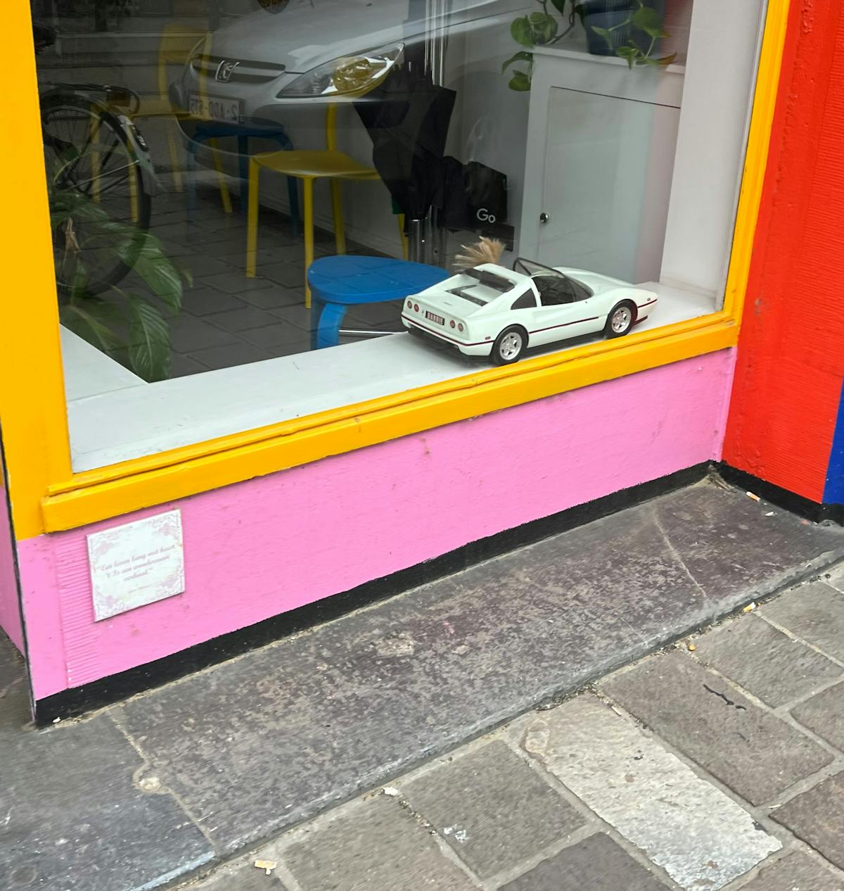 Cozy minimalist bedroom with warm neutral bedding, layered textiles, and light wood nightstands