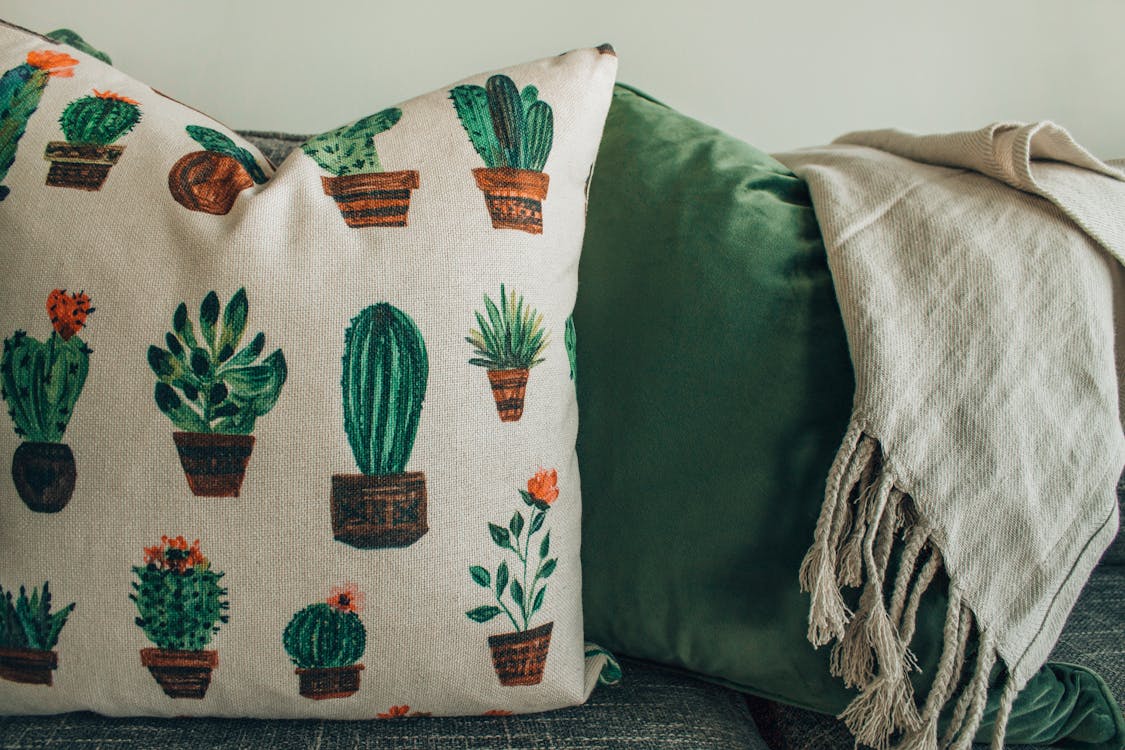 White, Green, and Brown Throw Pillow