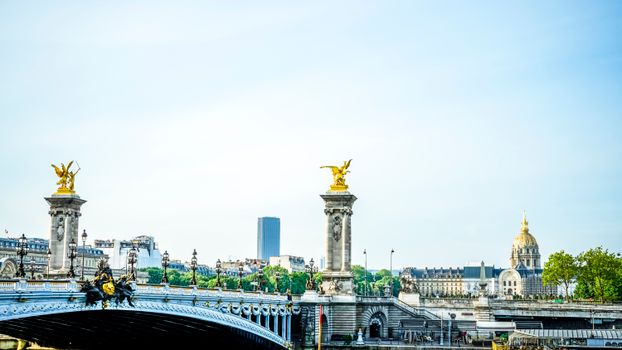 Capture of the Alexandre III bridge and Paris skyline with golden statues.