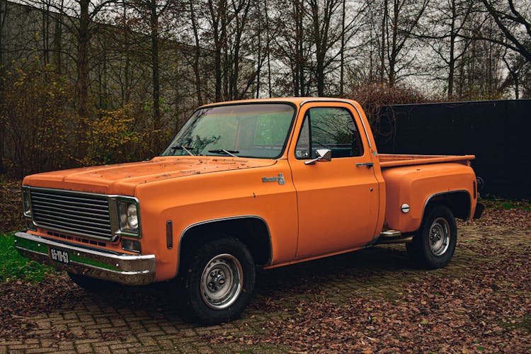 Vintage Orange Truck With Chrome Bumper