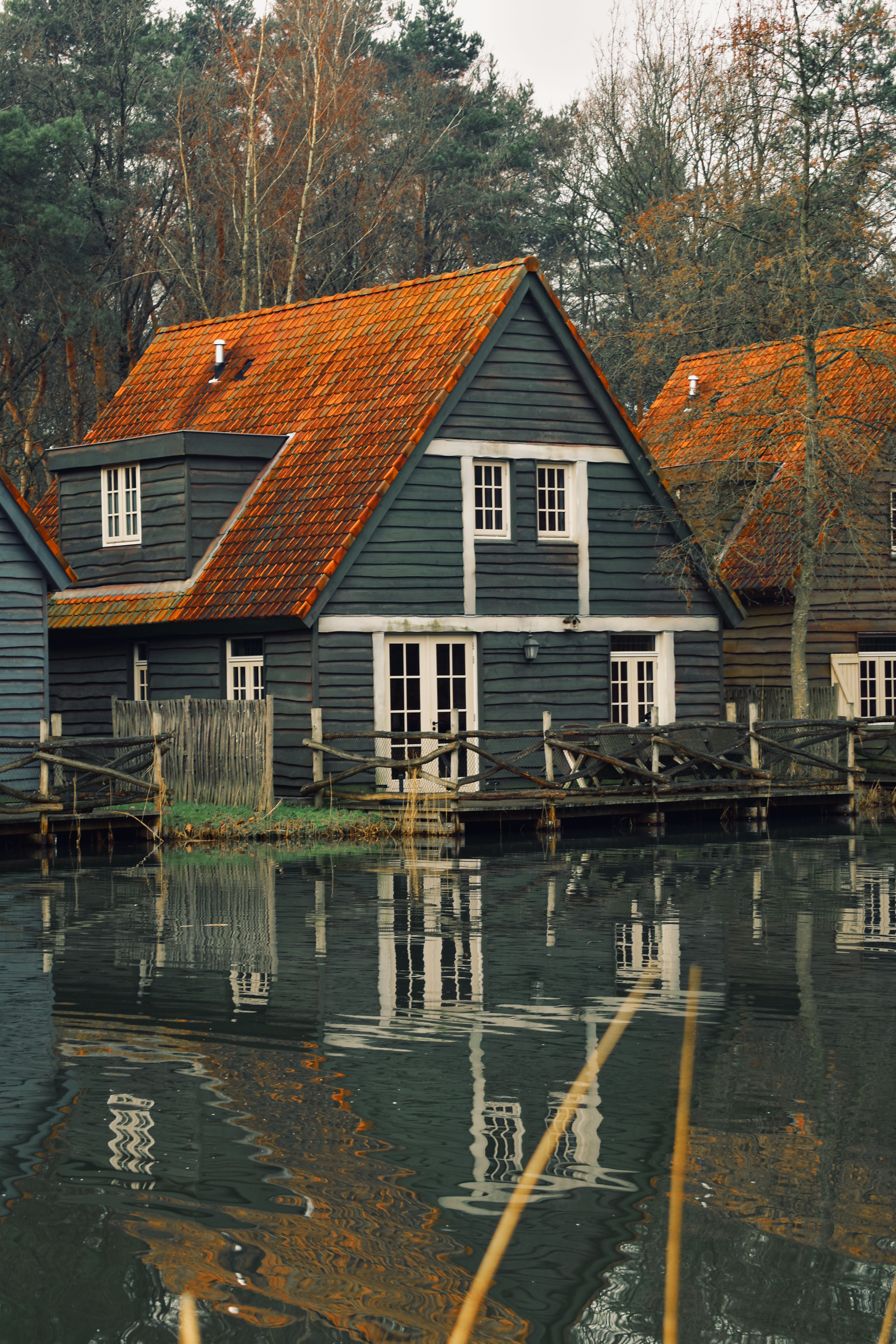 A White and Gray Wooden House on Body of Water · Free Stock Photo