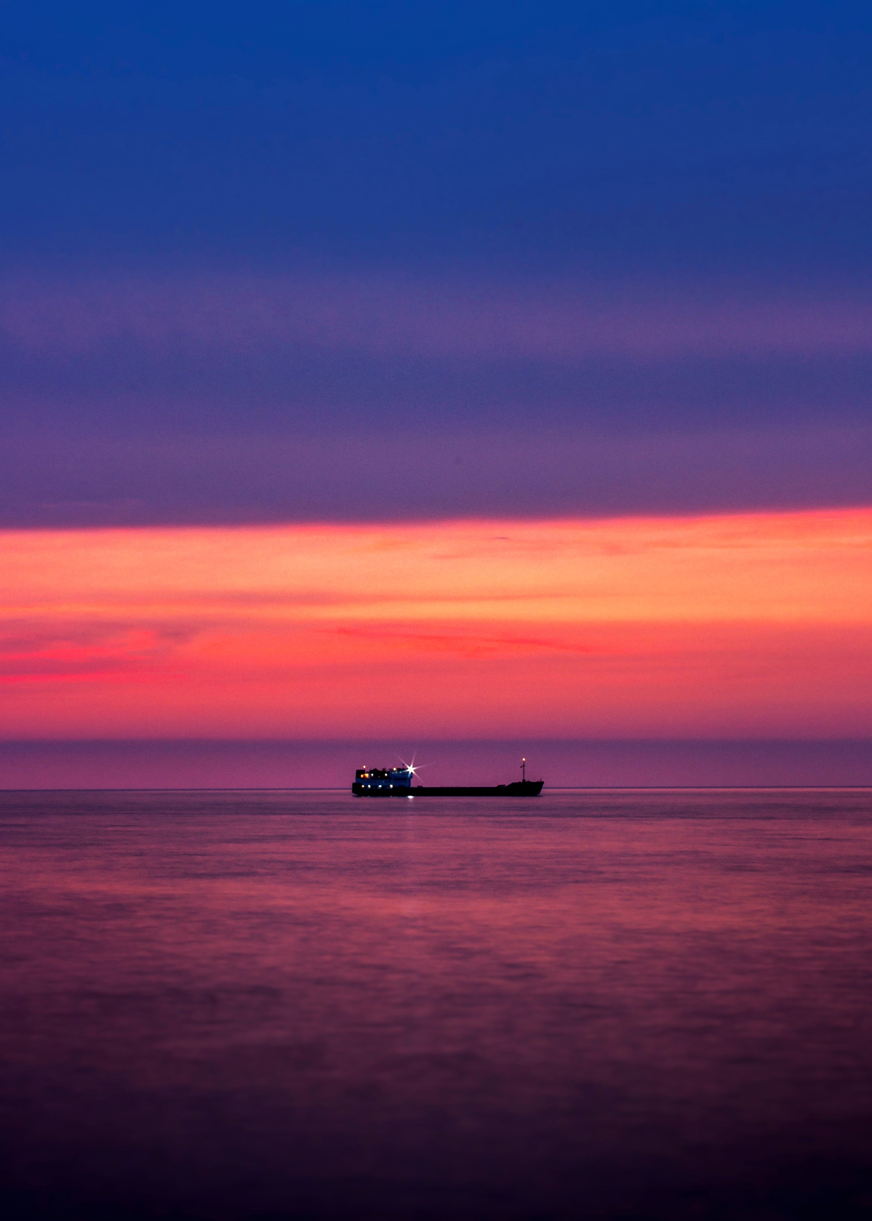 Silhouette of Ship on Sea in Sunset Scenery · Free Stock Photo