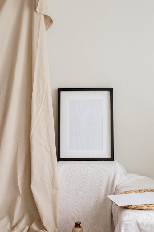 A Black Wooden Frame Near White Wall