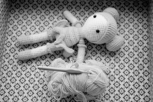 White Bear Plush Toy on White and Black Textile