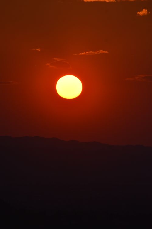 Free Bright sunset over Tirana with a silhouette skyline, showcasing vibrant warm colors. Stock Photo