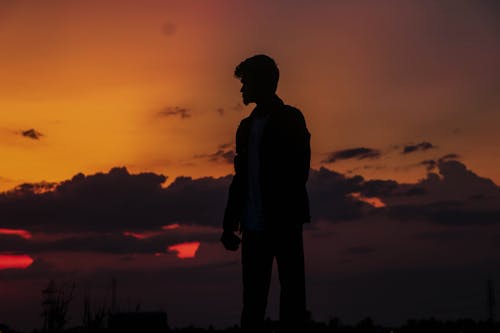 Silhouette of a Man During Sunset