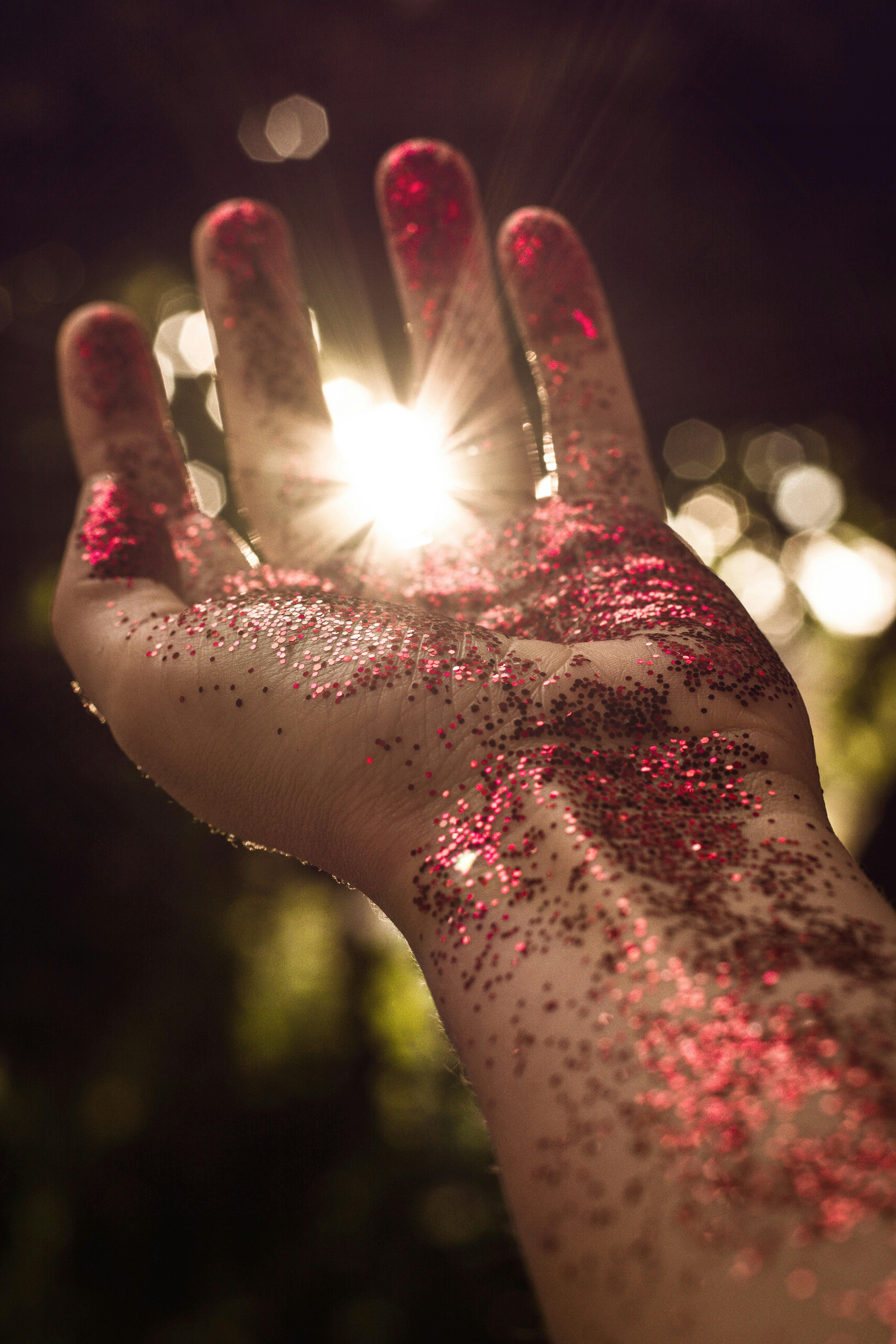 Left Person's Arm With Red Glitter · Free Stock Photo