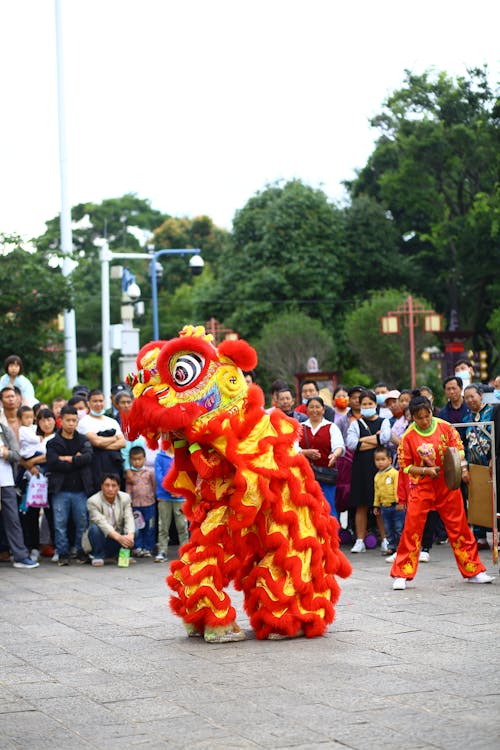 Crowd Watching Dragon Dance on a Street
