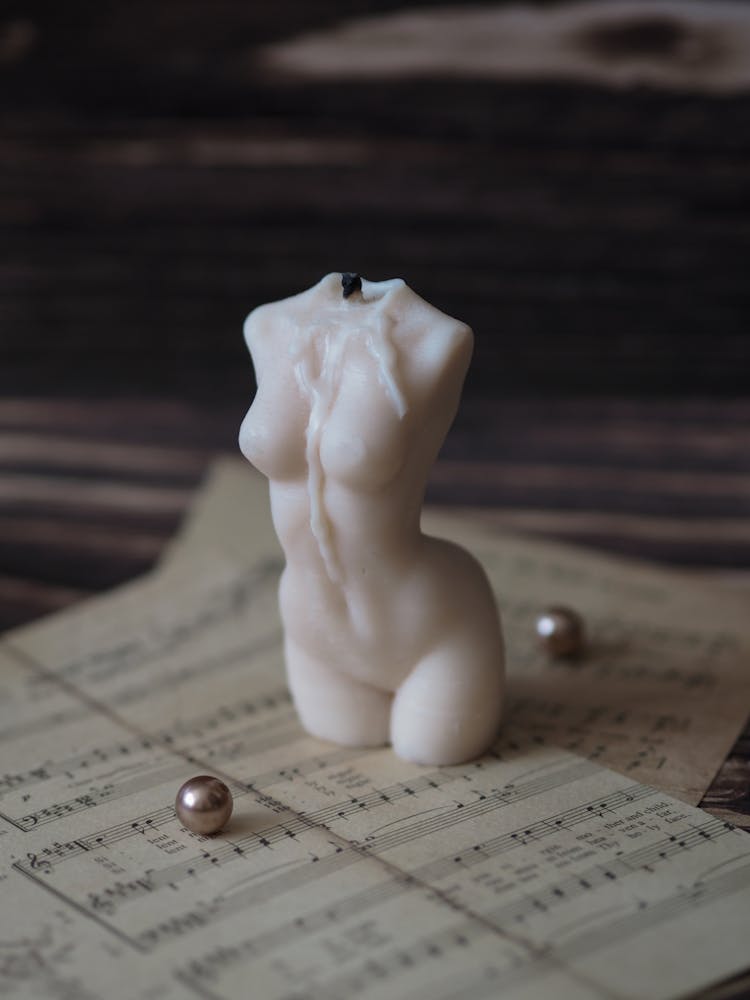 Close Up Shot Of A Body Shaped Candle