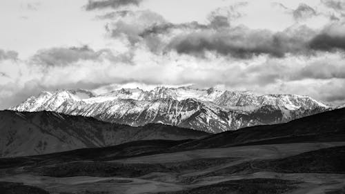 Grayscale Photo of Mountains