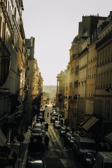 Elegant Parisian street scene with historic buildings and bustling atmosphere. Perfect for city and architecture themes.
