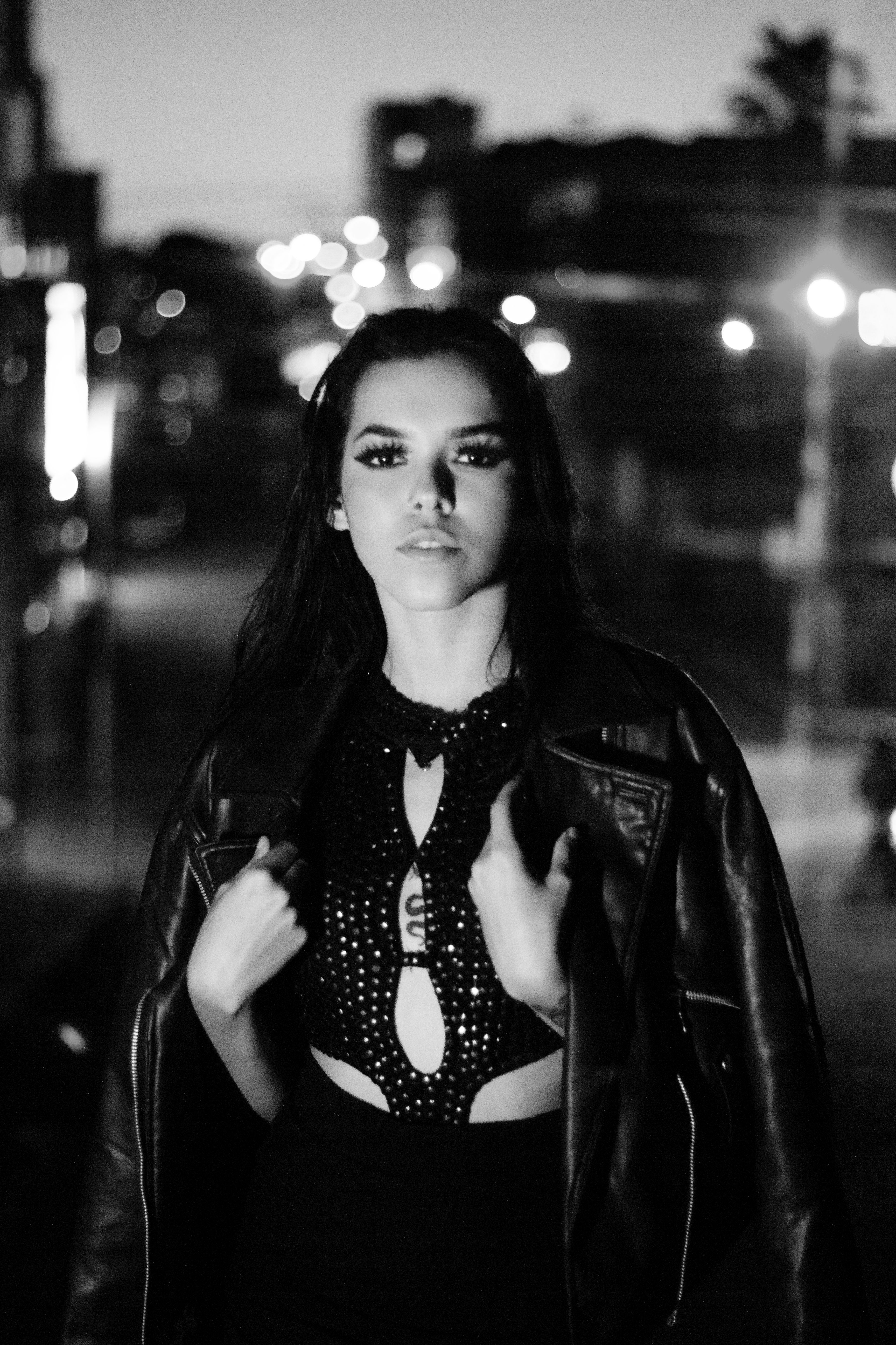 Black and White Photo of a Woman Wearing Leather Jacket · Free Stock Photo