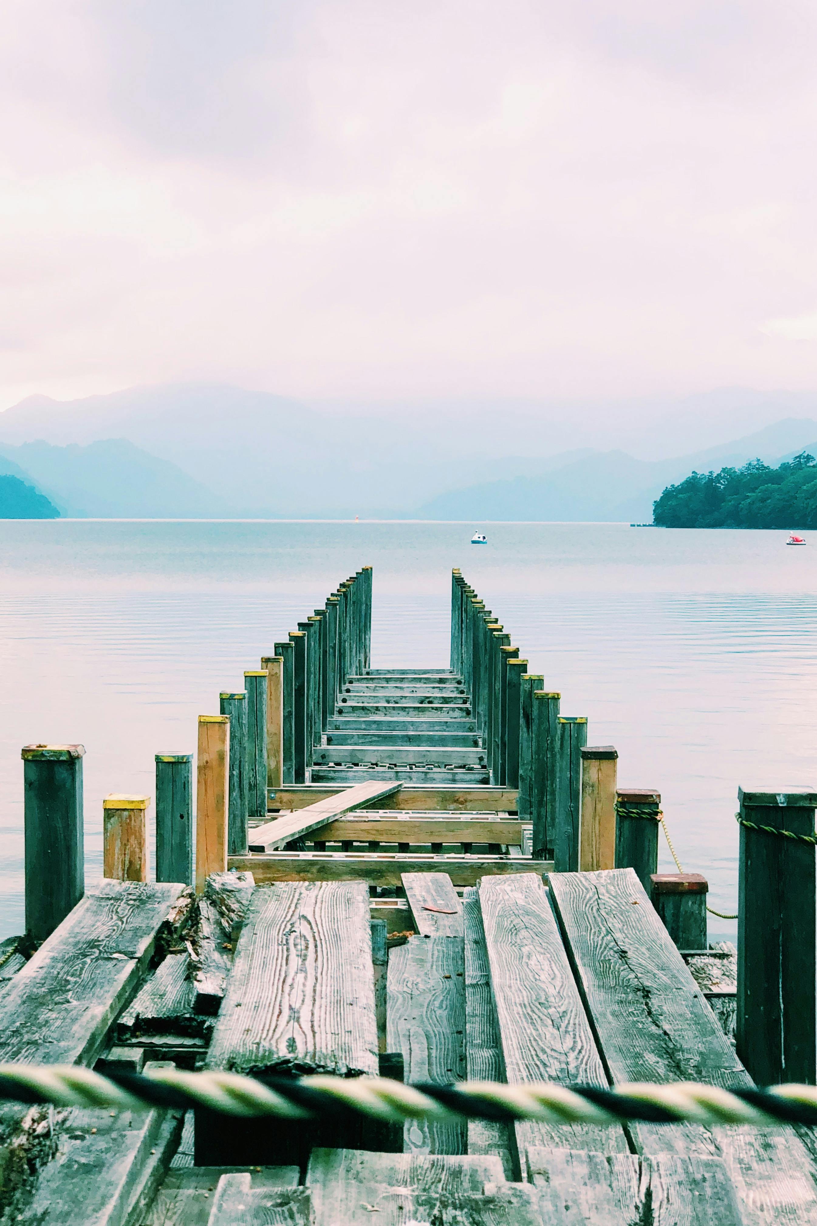 Brown Wooden Dock Near Seashore · Free Stock Photo