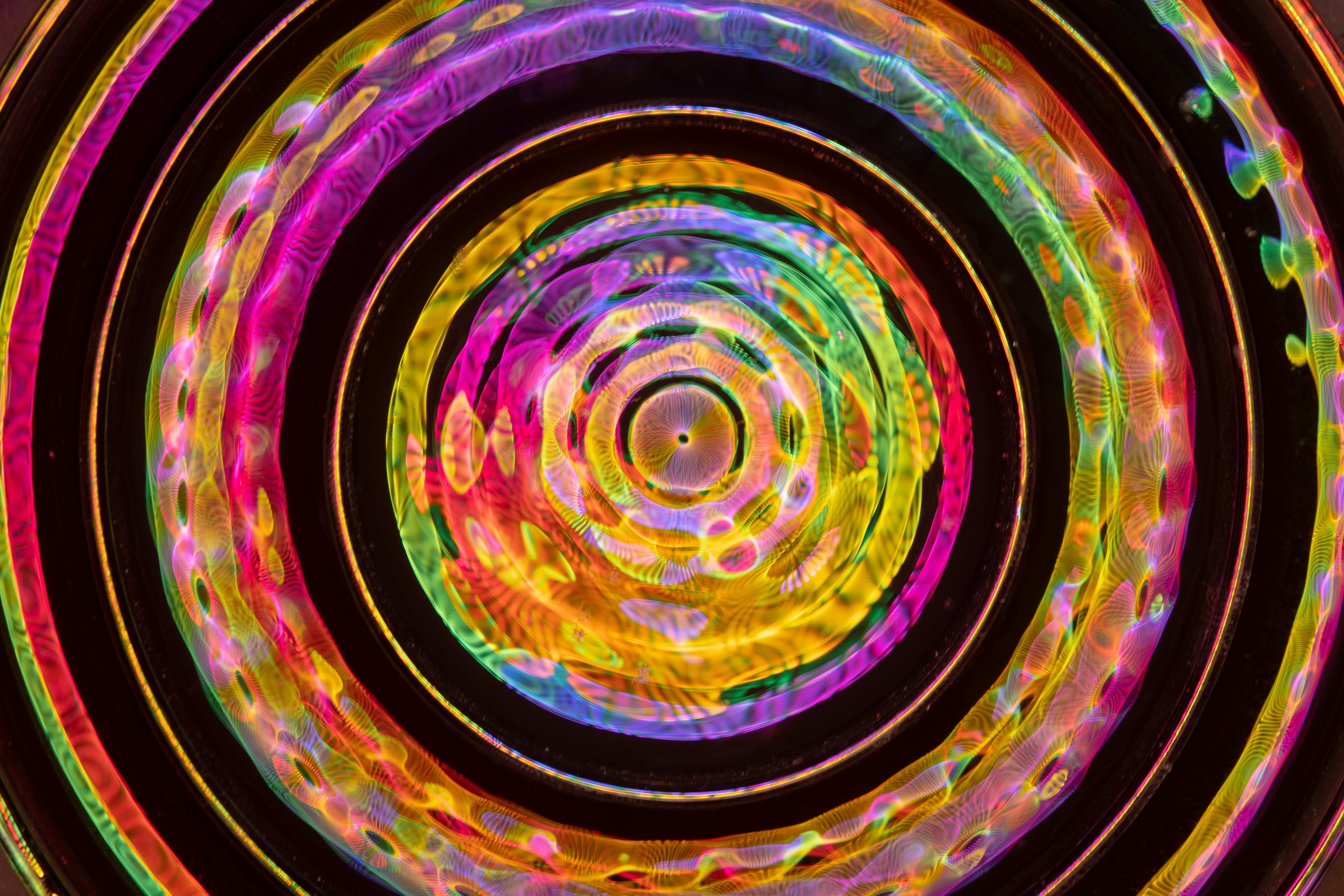 Colorful, abstract circular kaleidoscope pattern with vibrant hues for creative backgrounds.