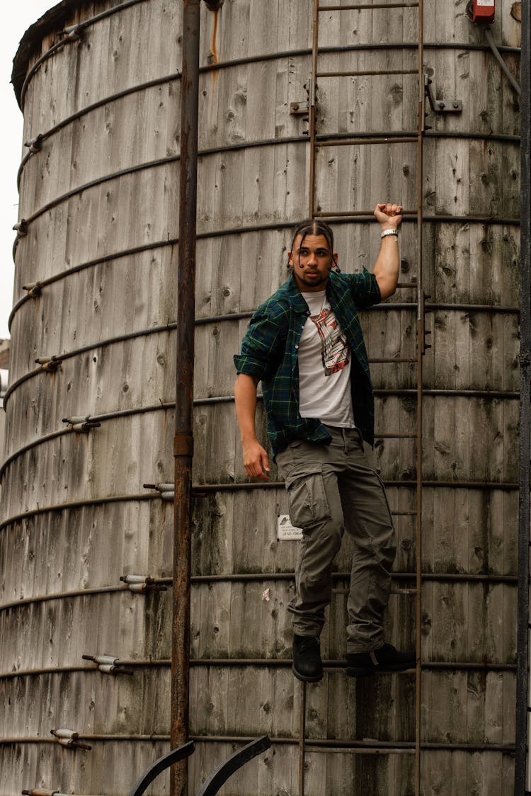 Man Model Climbing Watertower