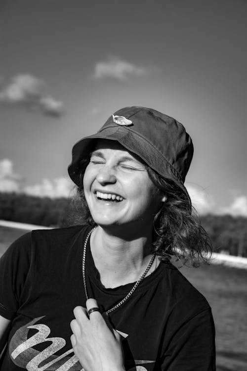Black and White Photo of a Woman Laughing
