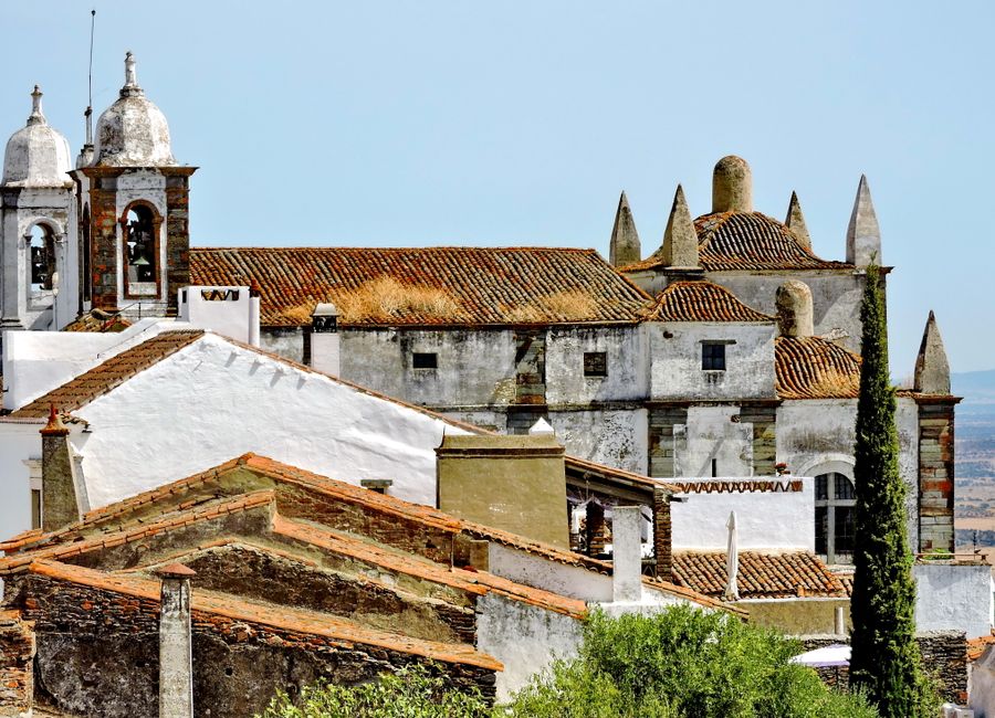 View of the historic Monsaraz Castle with scenic surroundings in Portugal's Alentejo region.