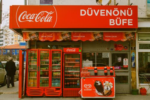 Free A vibrant Coca-Cola booth in Kayseri, Türkiye, showcasing beverages at a bustling street market. Stock Photo