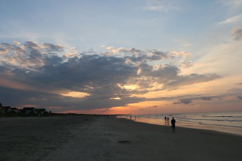 Foto profissional grátis de alvorecer, cair da noite, costa