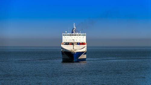 Free White and Brown Ship on Sea Under Blue Sky Stock Photo