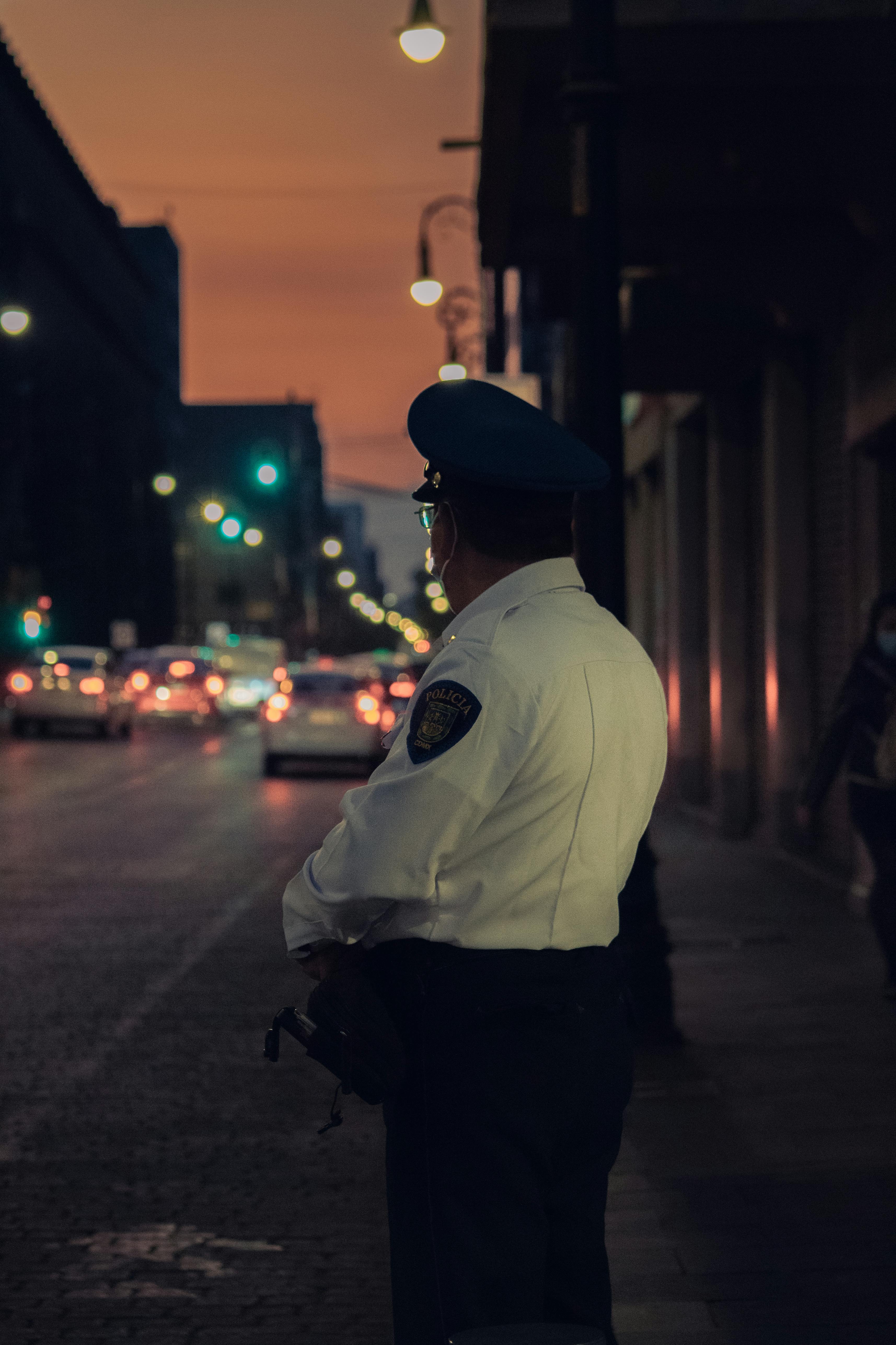 Police Officer Wearing his Uniform · Free Stock Photo