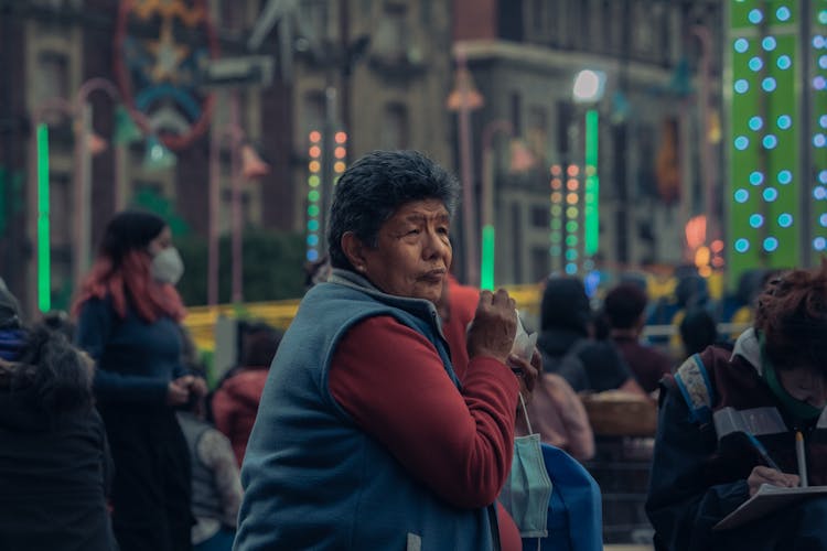 Photo Of A Elderly Woman Keeping Medical Mask And Standing On The Street