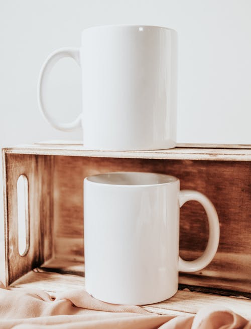 White Mugs on Wooden Crate