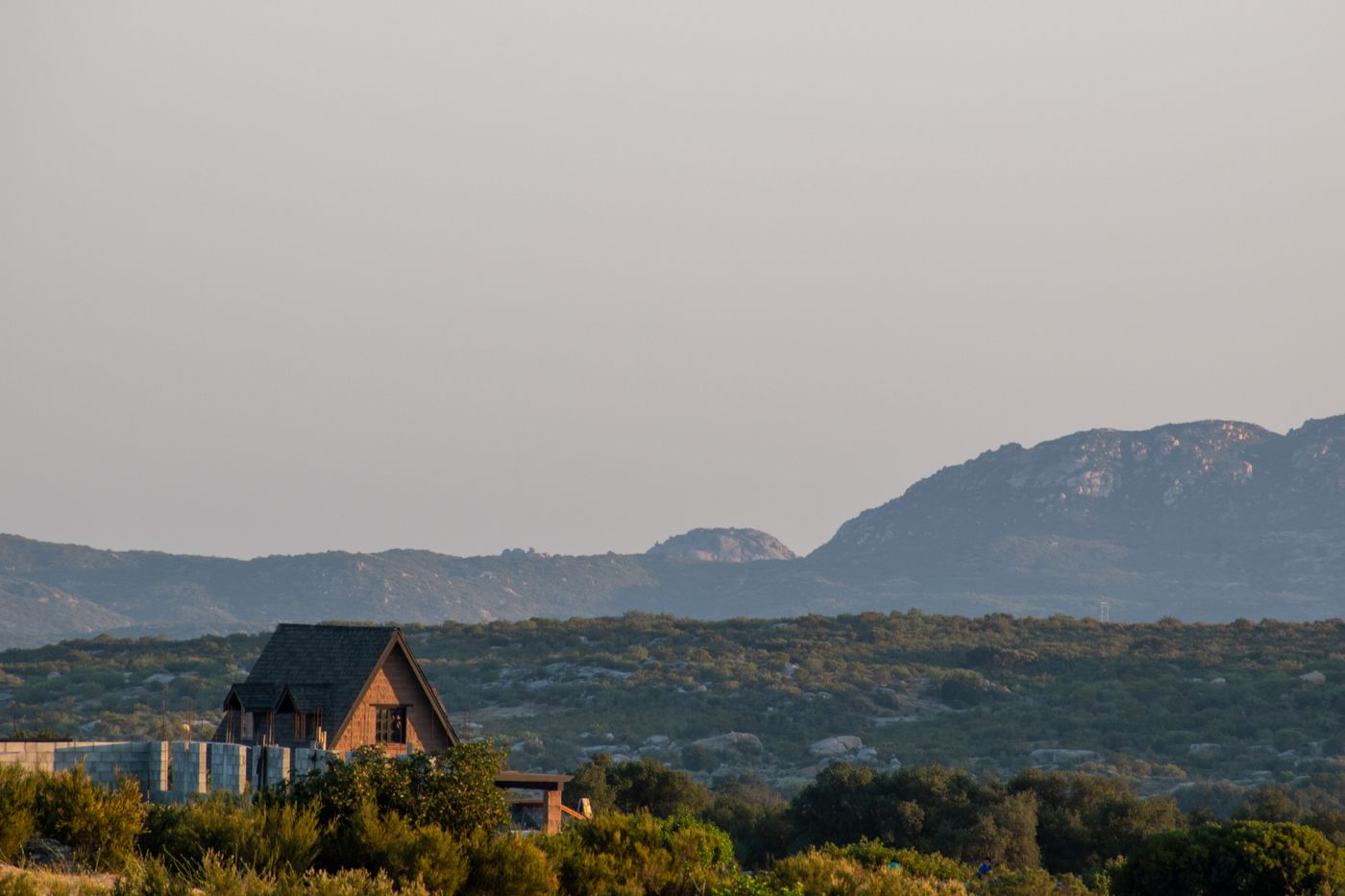 A cottage below rolling mountains in Tecate, Baja California, Mexico