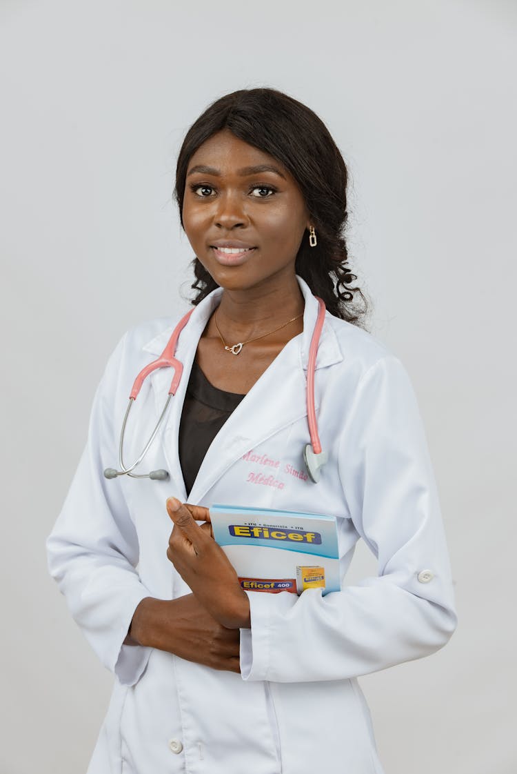 Woman Doctor In White Apron With Stethoscope