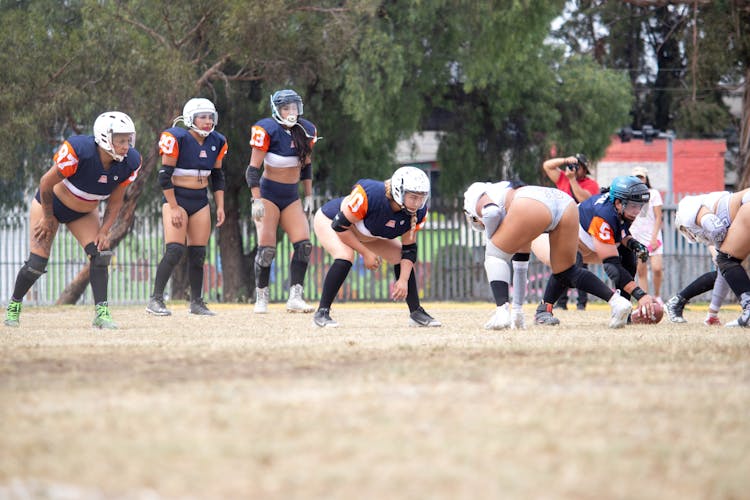 Women In Uniform Playing Rugby On Field