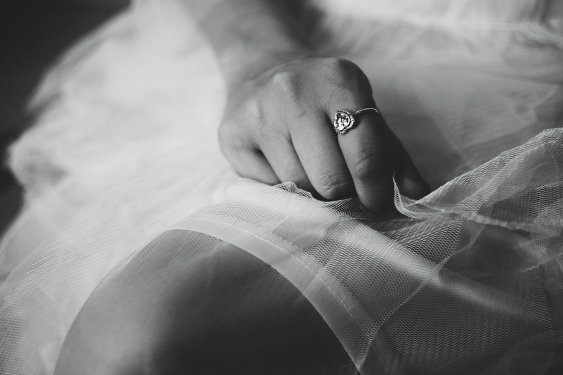 Grayscale Photography of Person Wearing Ring