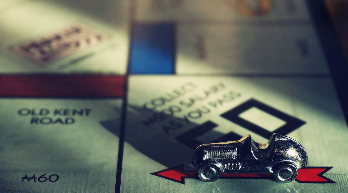 Classic Monopoly board game pieces recalling family game nights