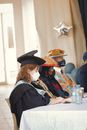 Woman in Black Academic Dress and Mortar Board
