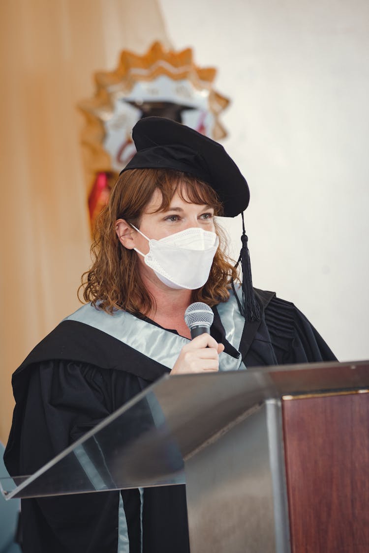 Woman In Mask During Graduation Ceremony