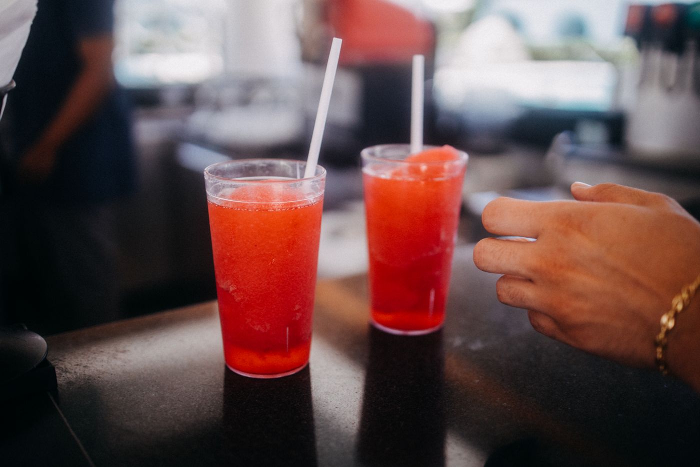 Red frozen drinks with straws
