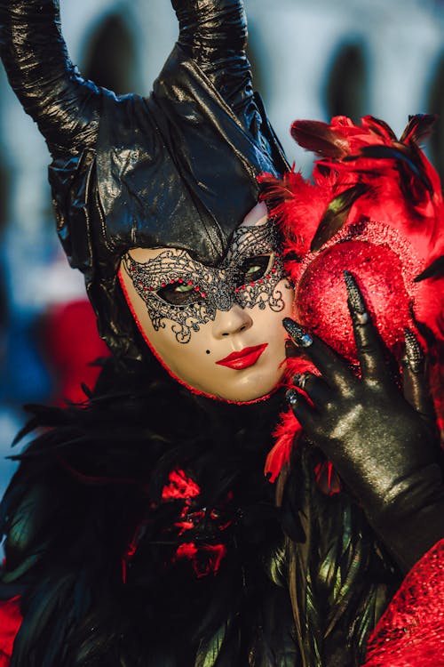 Person Wearing Black and Red Mask