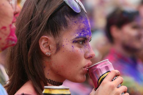 Free Woman in Blue and White Sunglasses Drinking from a Cup Stock Photo